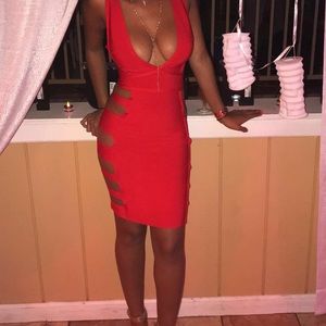 Red Knee Length bandaged cut out side dress
